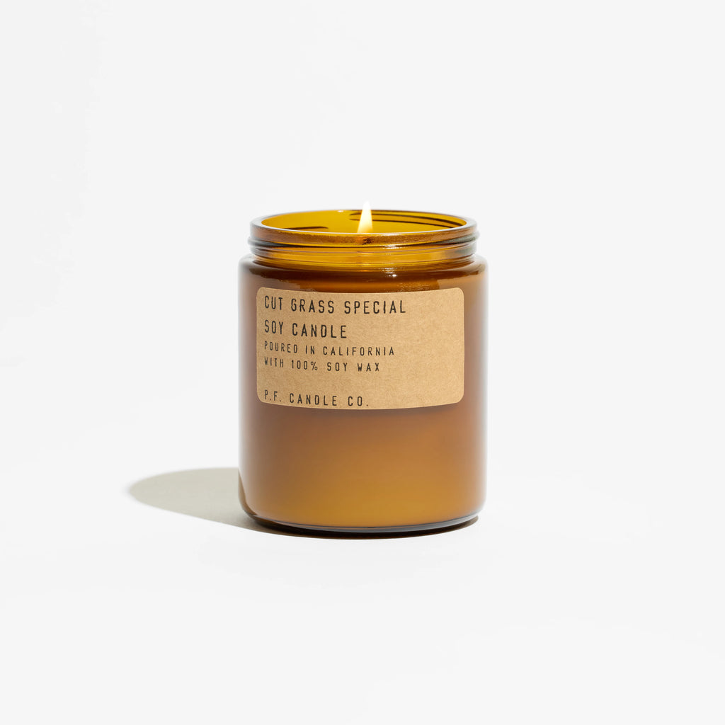 KarLen’s Inc Cut Grass Special Standard Candle in green wax with label