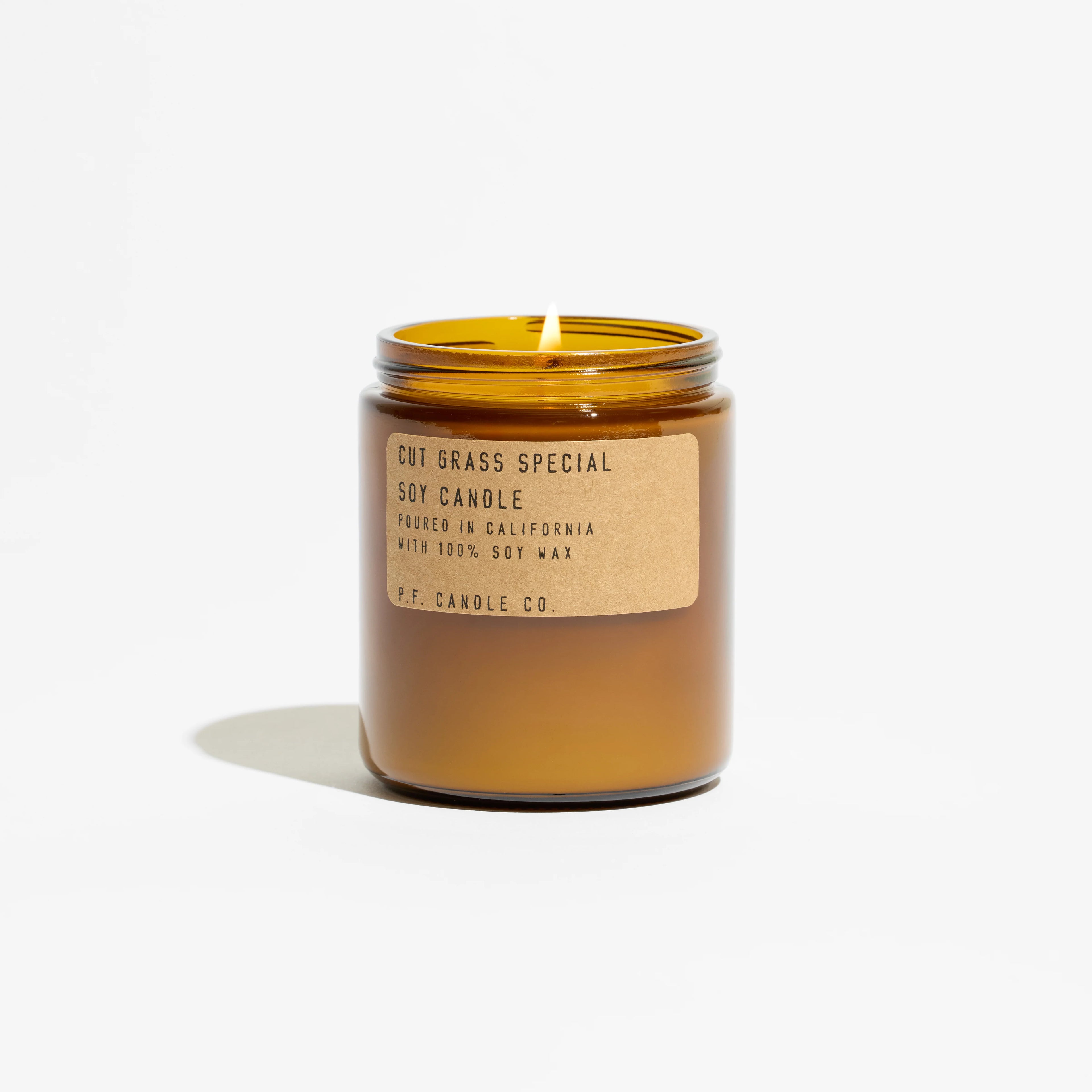 KarLen’s Inc Cut Grass Special Standard Candle in green wax with label